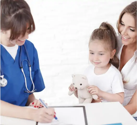Young pediatrician doctor talking with girl and her mother