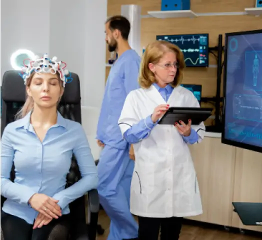 Patient woman with scanning device on her head and doctor scheduling it with tablet in hand