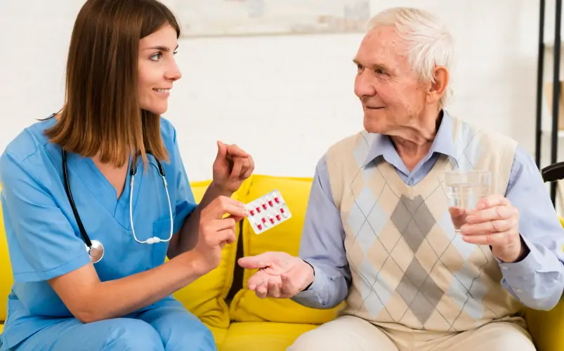 A female personal nurse talks to dementia old patients